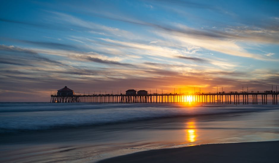 Captivating sunset over Huntington Beach Pier with vivid colors and serene seascape.